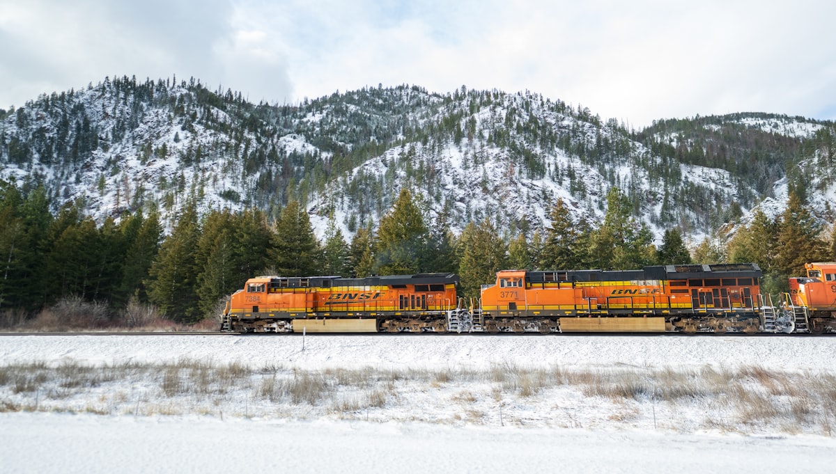 Locomotive pulling bulk commodity tank cars on railroad tracks
